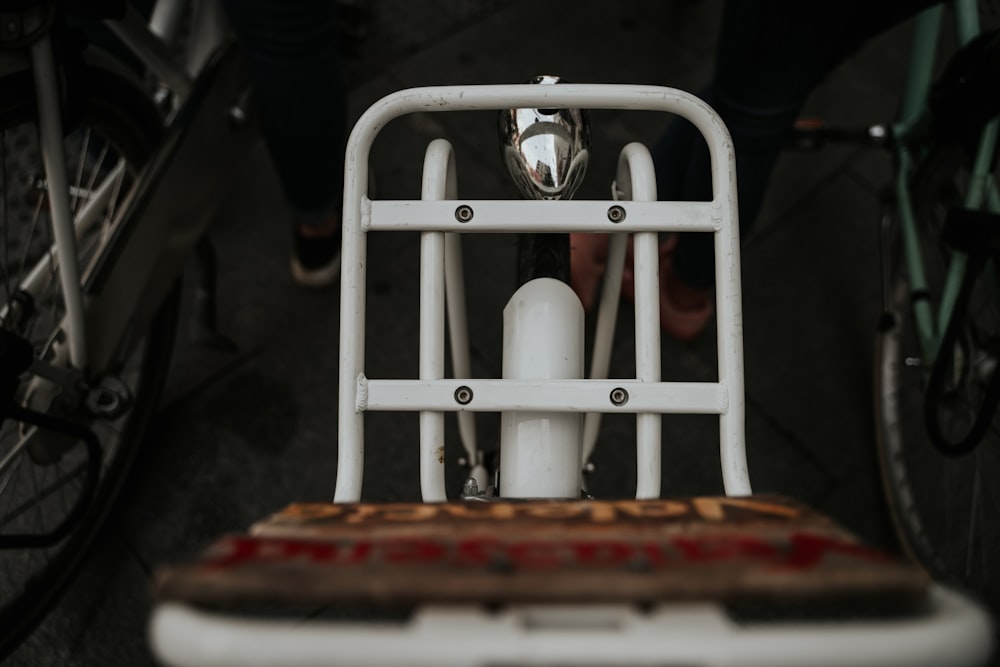 white ceramic mugs on white steel rack