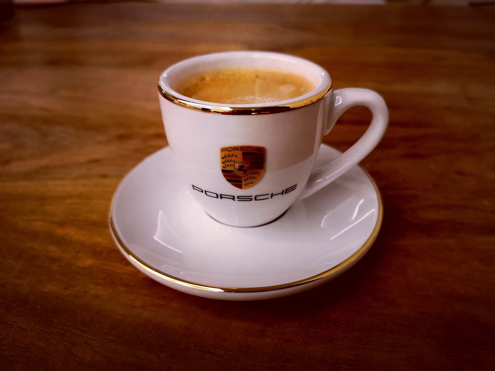 white ceramic cup on white ceramic saucer