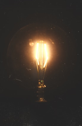A glowing lightbulb emerging from a complex web of data streams, symbolizing moments of clarity.
