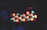 A dark background highlights a cluster of brightly colored LED lights. The lights are predominantly green and red, arranged in a rectangular pattern. They emit a soft, glowing effect against the darkness.