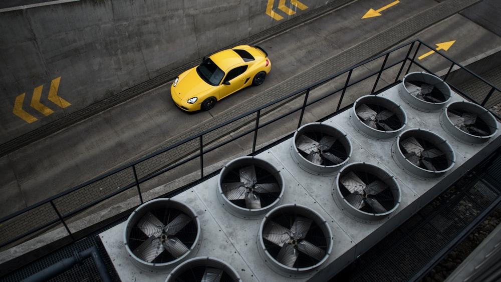 yellow and black ferrari sports car