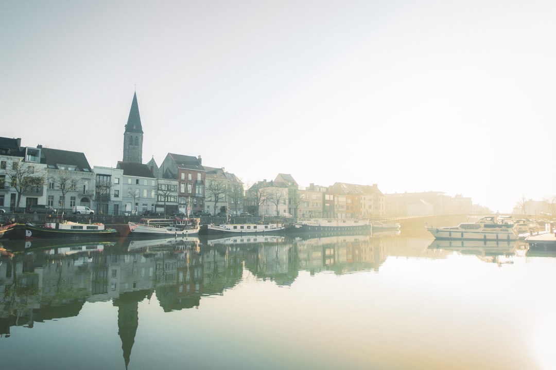 body of water between buildings during daytime