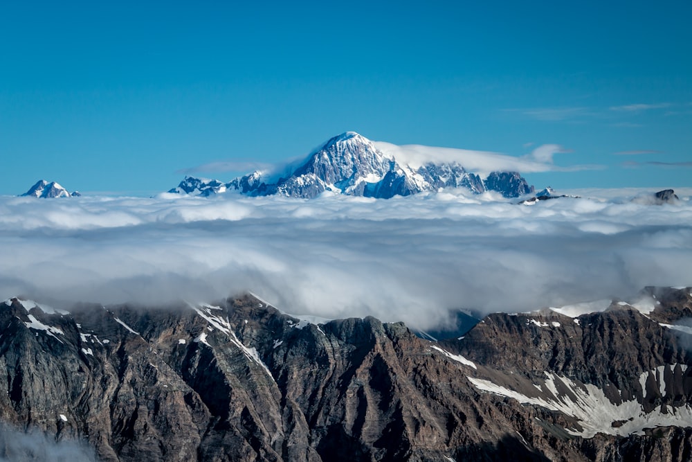 snow covered mountain under blue sky during daytime