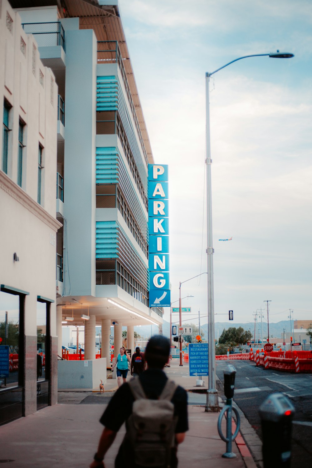 white and blue building near cars during daytime