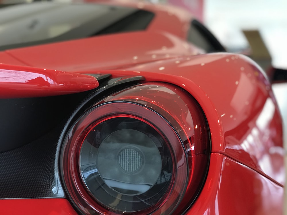 red and black car in close up photography