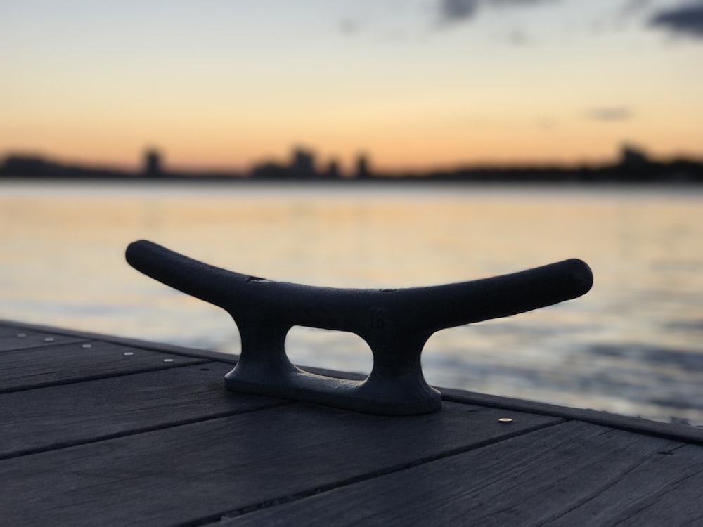black wooden stand on brown wooden table during sunset