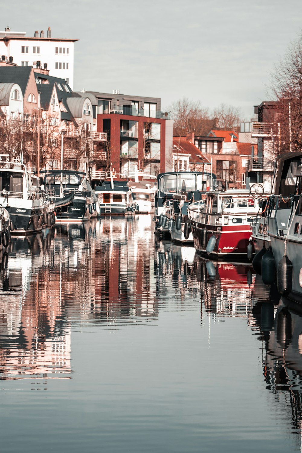 red and white boat on water