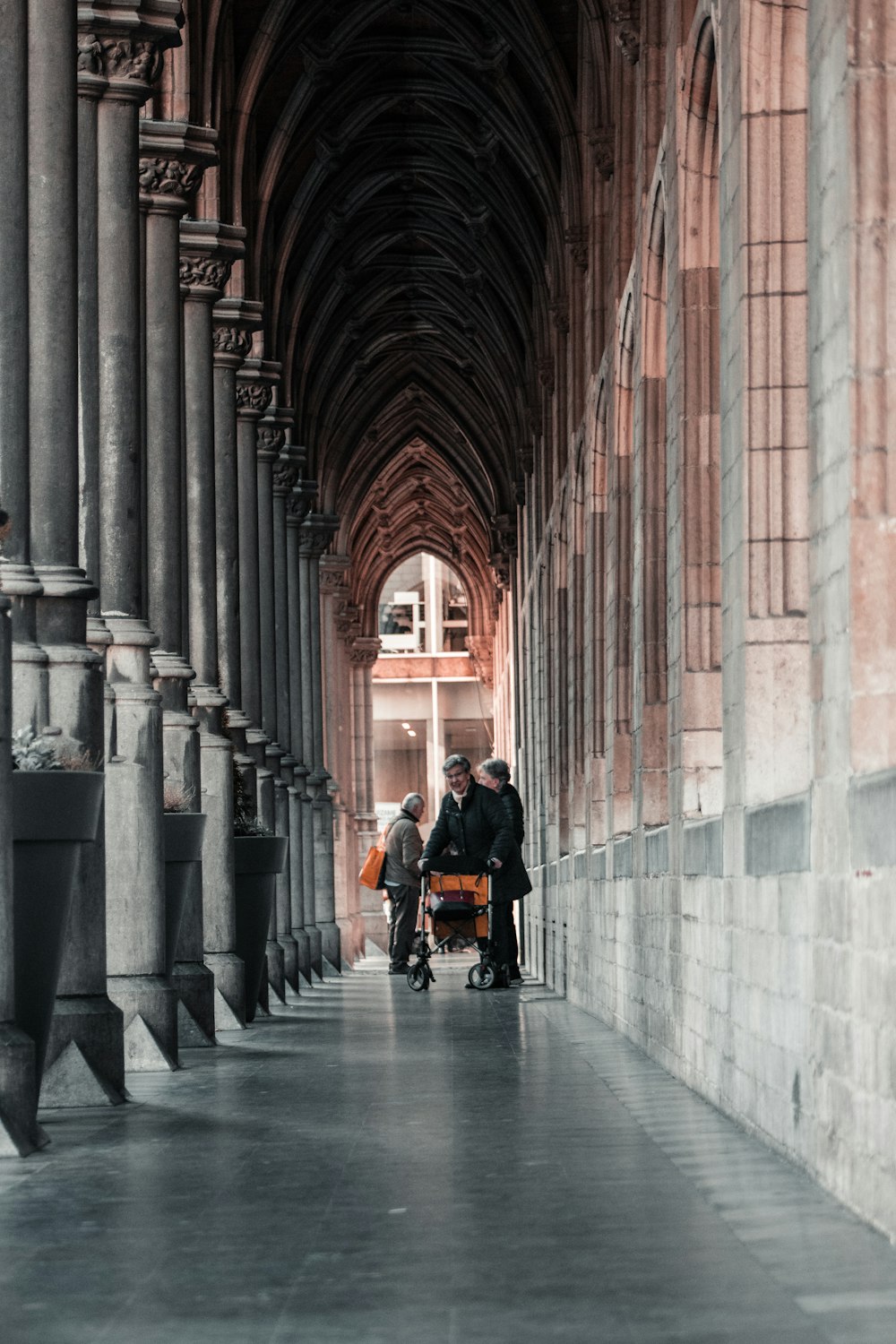 man in black jacket sitting on black wheelchair