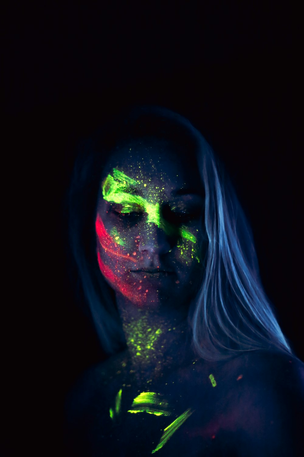 woman with green and red face paint