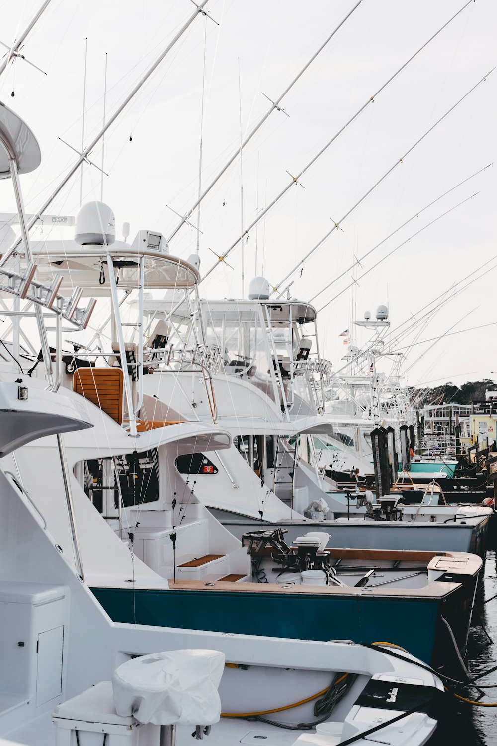 white and brown yacht on dock during daytime