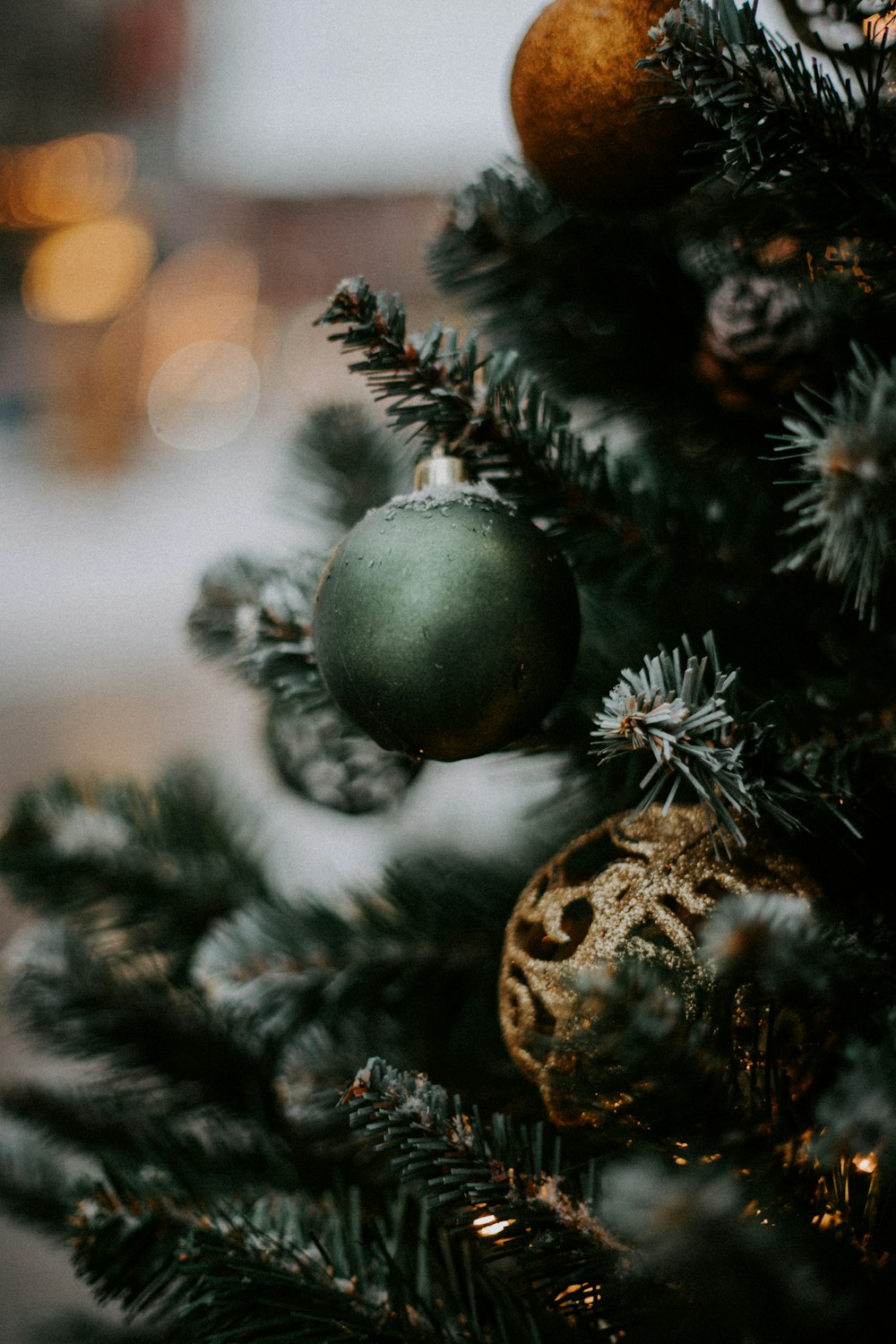 silver christmas baubles on green christmas tree