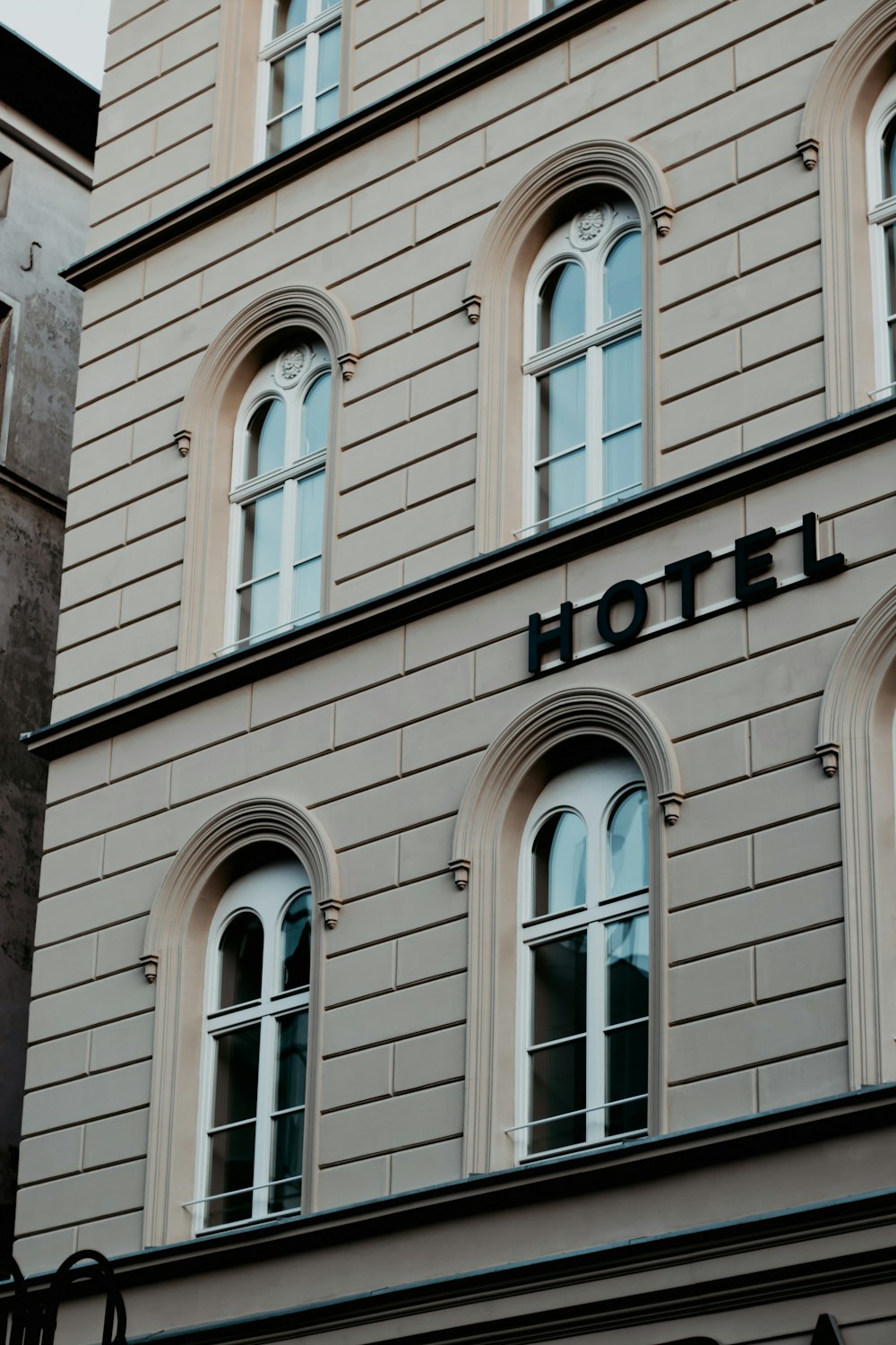 a tall building with a clock on the front of it