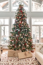 green christmas tree with red and white baubles