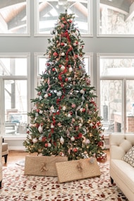 green christmas tree with red and white baubles