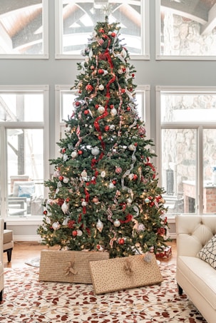green christmas tree with red and white baubles