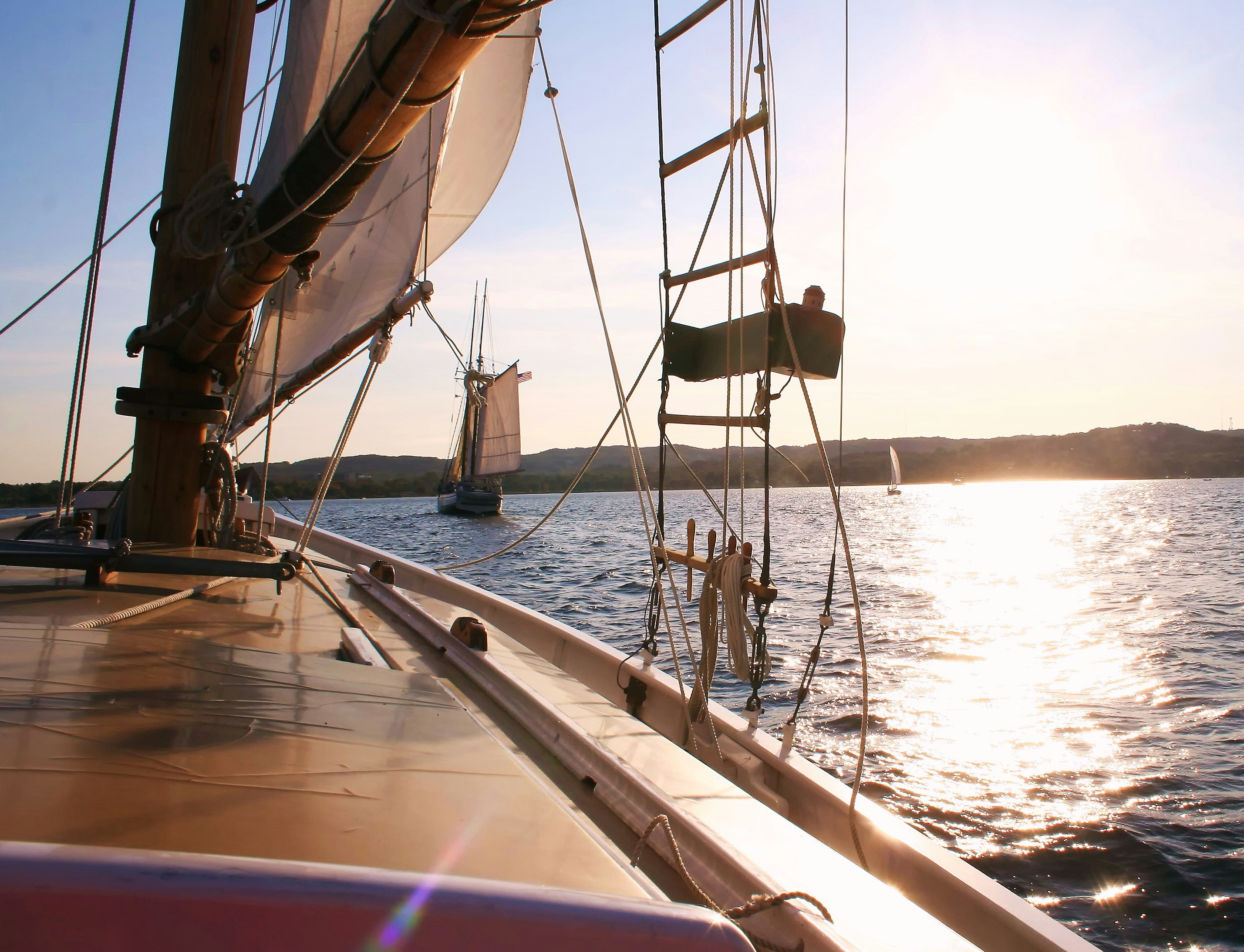 brown and white sail boat on sea during daytime