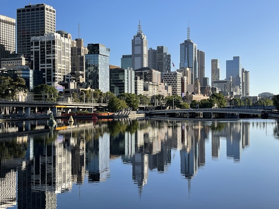 body of water near city buildings during daytime