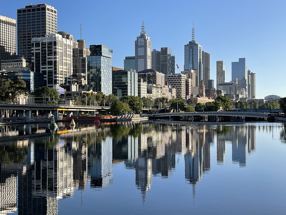 body of water near city buildings during daytime