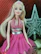 A close-up of a vibrant Barbie doll dressed in a sparkling outfit.