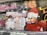 A vibrant street art mural features a cartoon snowman wearing a face mask and holding a broom, facing a duck character dressed in a red Santa outfit holding a spray bottle. The background includes graffiti in various colors, and the words 'HIP HOP TURNED BROKE MY HEART' are written at the bottom.