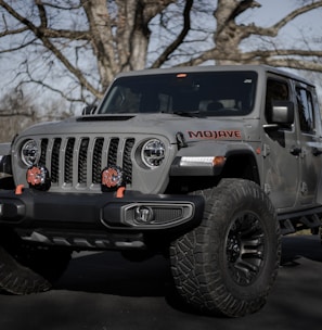 black and gray jeep wrangler on snow covered ground