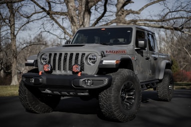 black and gray jeep wrangler on snow covered ground