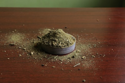 Enemy Ender cans arranged artistically on a rustic wooden table.