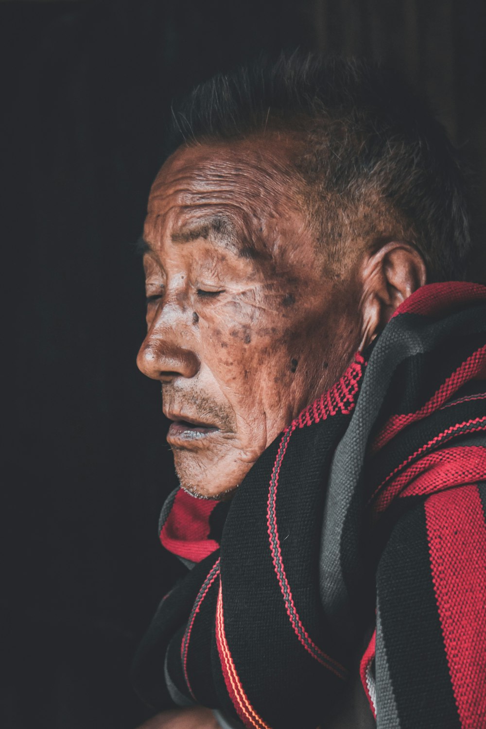 man in red and black jacket