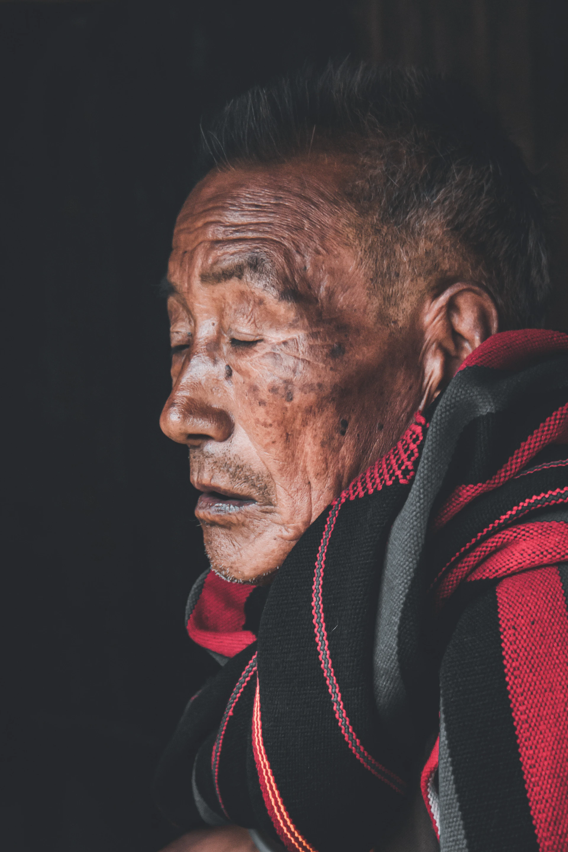 man in red and black jacket