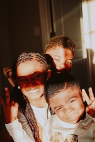2 boys wearing white and black shirt