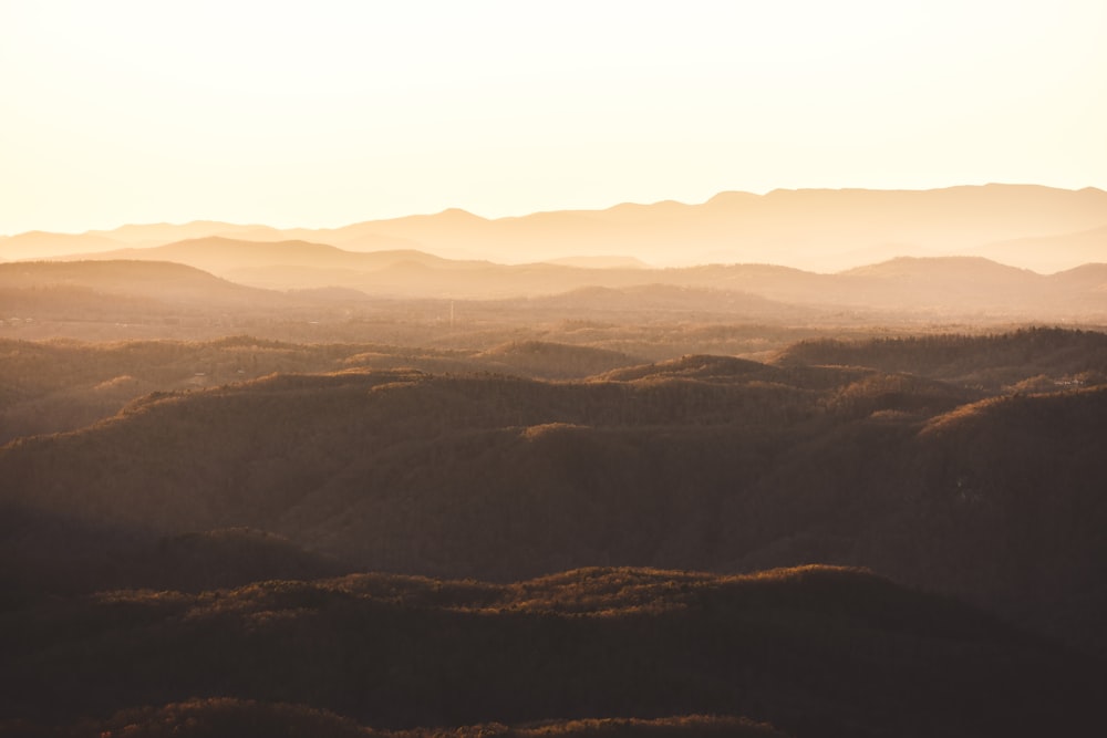 brown mountains under white sky during daytime