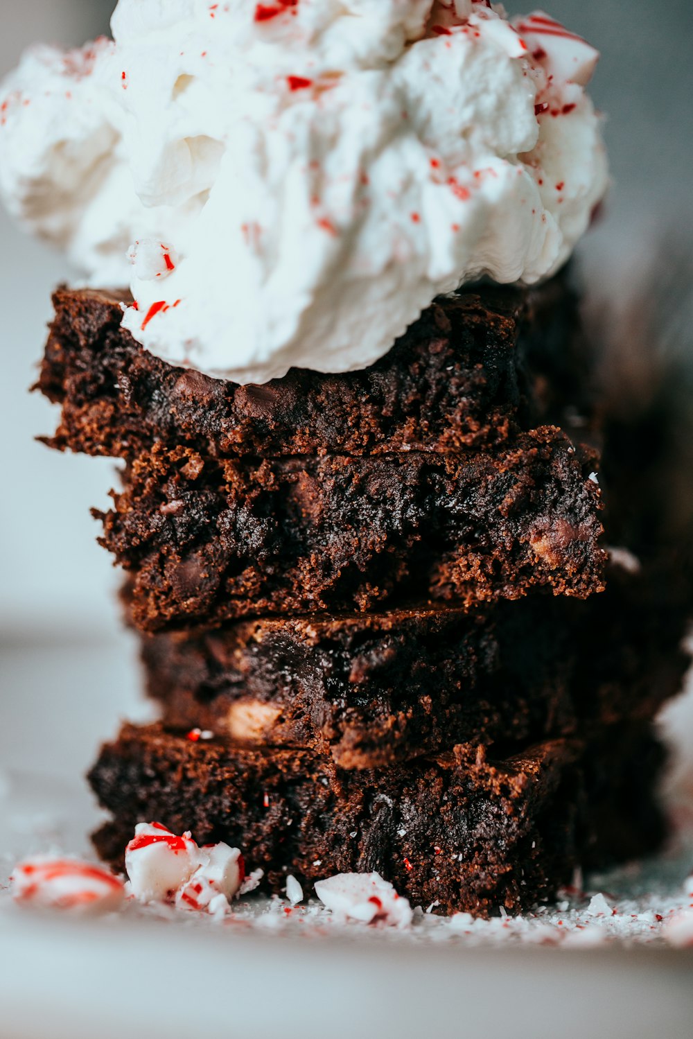 chocolate cake with white cream on top