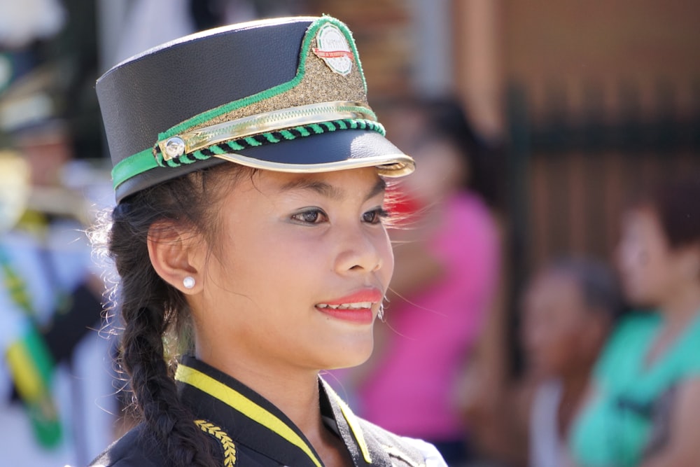 woman in green and black camouflage hat