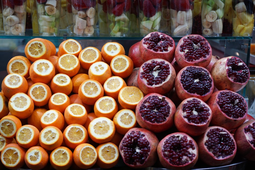 sliced orange fruits on clear glass display counter