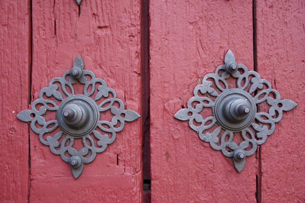 red wooden door with silver door knob