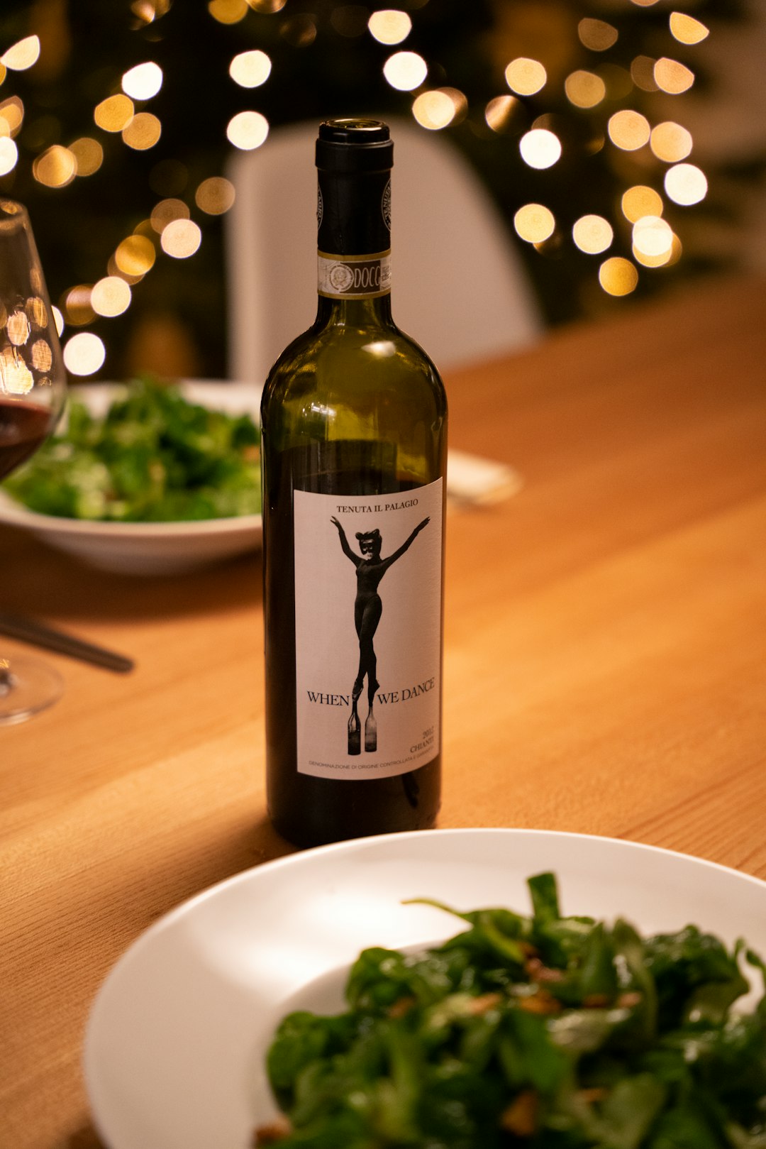 black wine bottle on brown wooden table