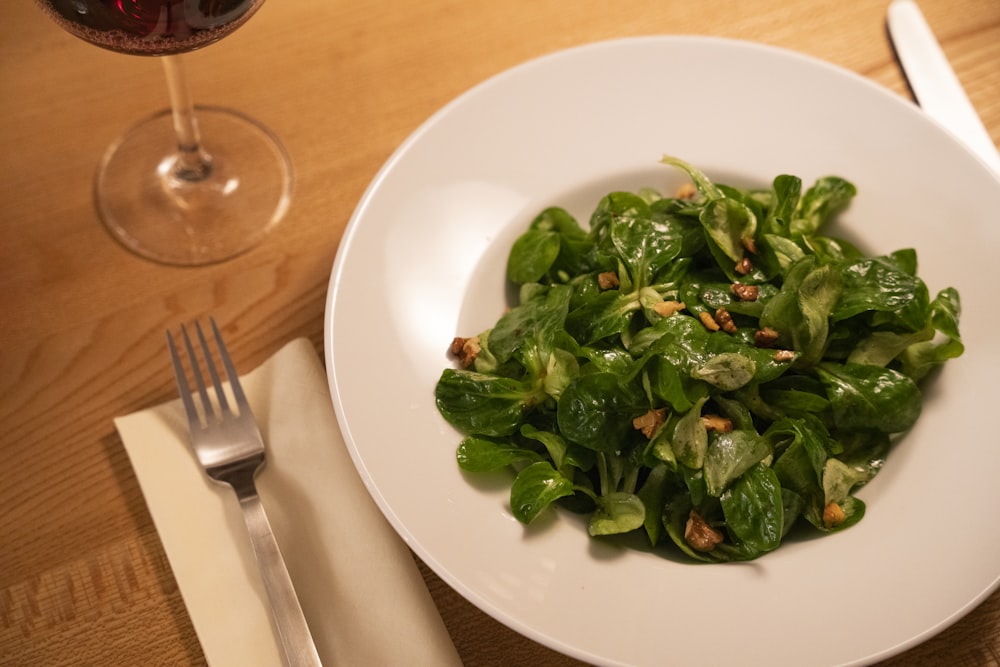 green vegetable on white ceramic plate