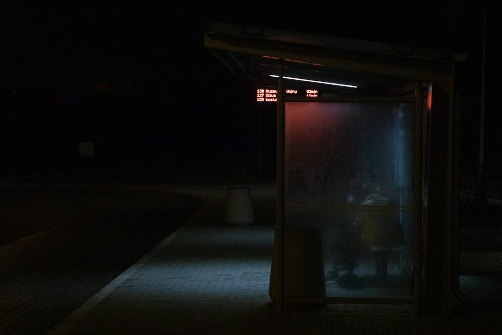 white framed glass window during night time