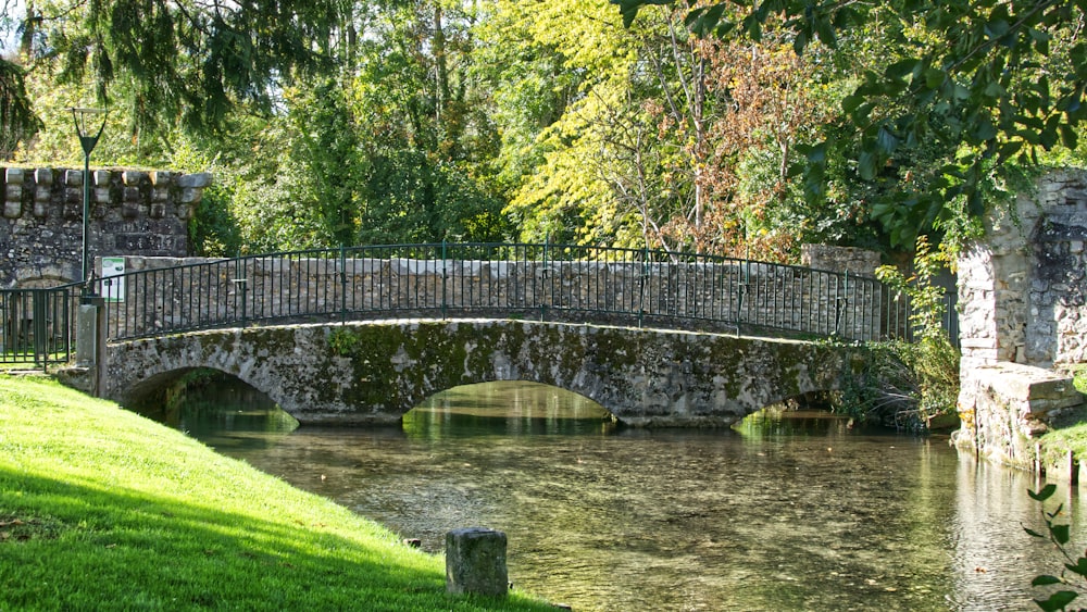 gray concrete bridge over river