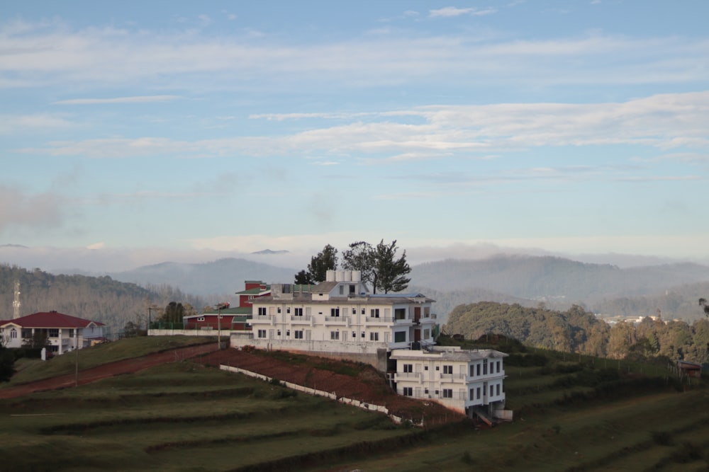 white concrete building near green trees during daytime