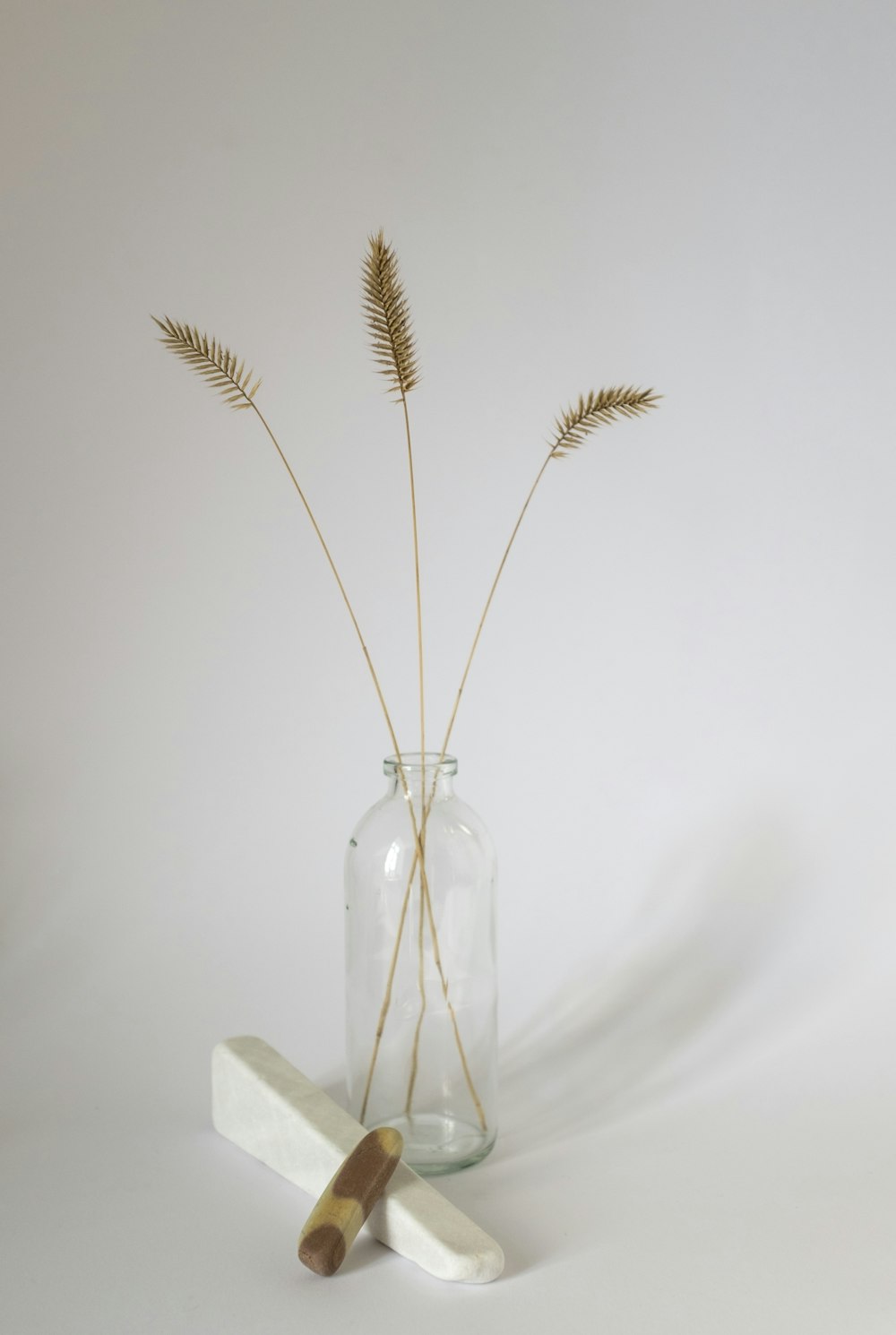 brown wheat in clear glass bottle