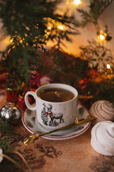 white ceramic mug on white ceramic saucer