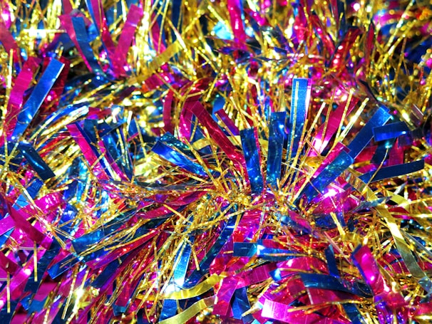 A vibrant display of colorful hair tinsel strands arranged beautifully.