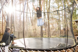 Girl jumping on trampoline