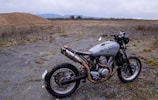 A rugged Husqvarna 701 motorcycle ready for desert terrain.
