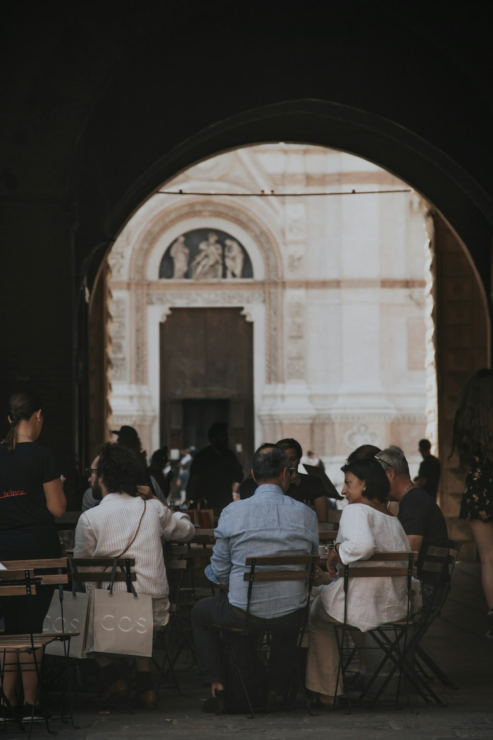 people sitting on chair in front of table