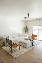 A sectional sofa with chaise in a bright living area, inviting relaxation with soft cushions.