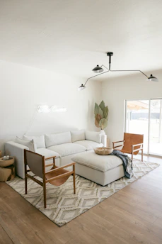 A sectional sofa with chaise in a bright living area, inviting relaxation with soft cushions.