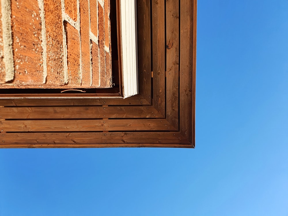 brown wooden framed glass window