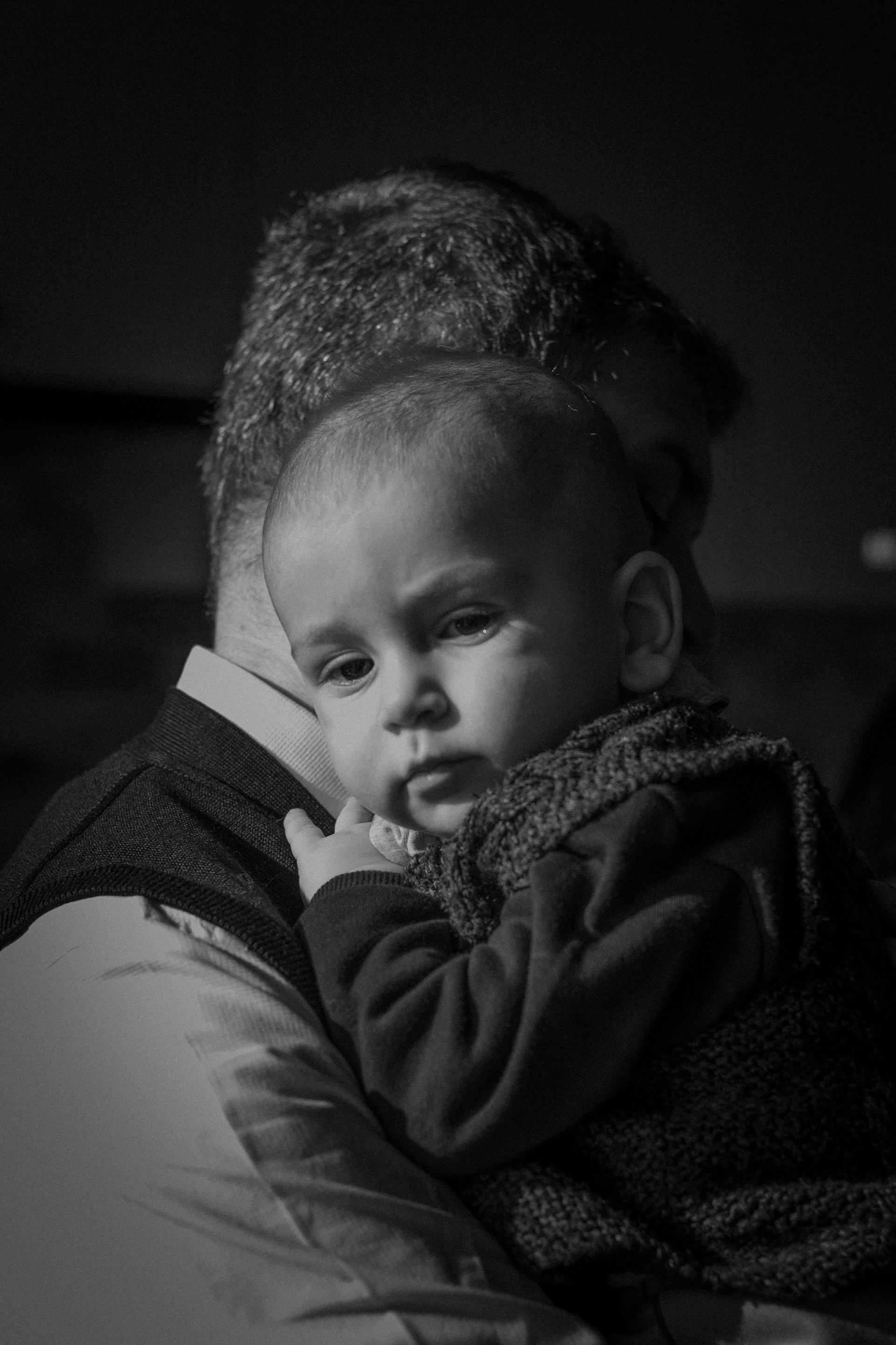 grayscale photo of boy in black jacket